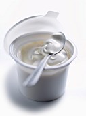 Pot of creme fraiche with spoon