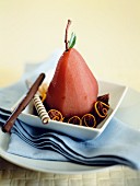 Poached red wine pears with chocolate sauce and ricotta