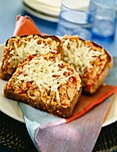 Open, toasted tuna fish sandwiches with melted cheese