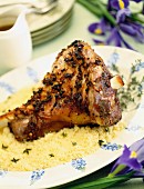 Leg of lamb on a bed of couscous