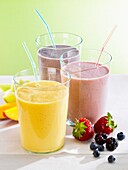 A trio of fruit milk shakes