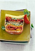 A layered terrine with pickled vegetables and Italian ham