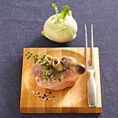 Raw veal knuckle on a chopping board