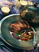 Ostrich fillet with cocoa and fried chanterelle mushrooms