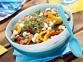 Pepper salad with goat's cheese, pine nuts and raisins