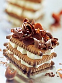 Rich tea biscuit and whipped cream mille-feuille topped with chocolate flakes