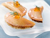 Salmon and cream cheese canapés with salmon roe