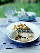 Grilled bass with sauté potatoes and lime