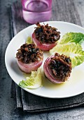 Red onions stuffed with duck conserve meat