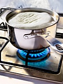 Cooking in a saucepan on a gas cooker