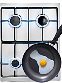 Cooking a fried egg on a gas cooker