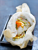 Bass,vegetable and orange papillote