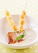 veal with cream sauce and gnocchis brochettes