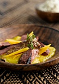 Wild duck with mango and mustard sauce