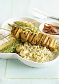 Turkey skewer with vegetables, wheat and sweet and sour sauce