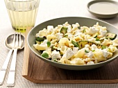 Pasta with pan-fried zucchinis,pine kernels and cheese