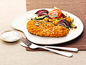 Breaded veal escalope with vegetables