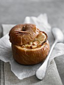 A baked apple filled with pine nuts and lemon