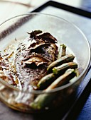 Oven-baked seabream, and courgettes with cinnamon