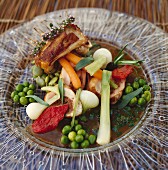 Mini rack of lamb with young vegetables