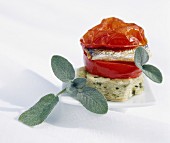 Sage cake with braised tomatoes and sardines