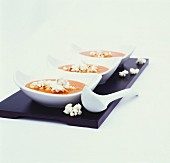 Tomato and pepper soup with popcorn