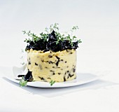 Polenta timbale with black trumpet