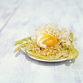 Wheat salad with dandelions, a soft egg and tete-de-Moine cheese