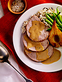 Cold sliced roast pork with Gribiche sauce ,rice and green beans