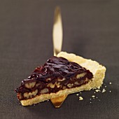 Portion of chocolate and pecan tart
