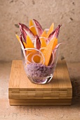 Cream of Vitelotte potatoes with red chicory leaves and thin slices of Mimolette