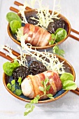 Rabbit wrapped in bacon with prunes