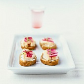 Cod and red onion crostinis