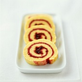 Rolled sponge cake filled with strawberry jam