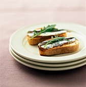 Anchovies and rocket on toast