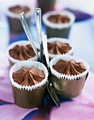 Small paper cups of chocolate mousse