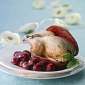 Quail with salami and stewed cherries