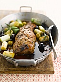 Saddle of pork glazed with balsamic vinegar,olives and leeks
