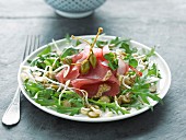 Red tuna carpaccio, rocket and beansprout salad with capers