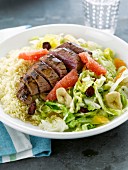 Beef fillet, semolina and mixed salad with fresh fruit