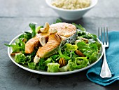 Salmon steak with dried fruit , broccoli and romanesco cabbage salad