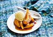 Caramelized pears with a scoop of vanilla ice cream