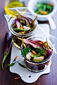 Pickled eggplants and bird peppers