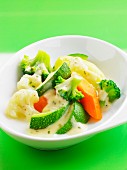 Steam-cooked vegetables in white sauce