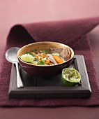 Beef broth with vegetables and coriander
