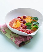 Cream of melon and watermelon soup with raspberries