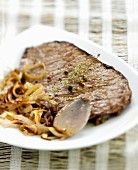 Flank with shallots