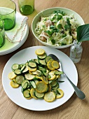 Pan-fried zucchinis with rosemary, white cabbage salad