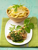 Rolled shoulder of lamb with pesto and peanuts