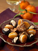 Dried fruit stuffed with goat's cheese and hazelnuts